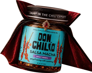 A jar of Don Chilio Spicy Árbol Salsa Macha in a vampire cape